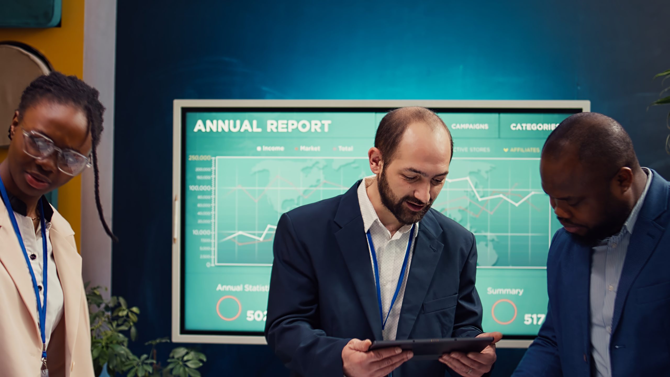 Startup colleagues reviewing data to improve customer satisfaction and retention